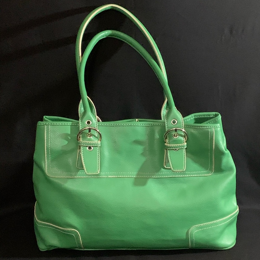 Lovely like new green purse. Very roomy interior